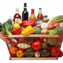 Color photo of a shopping basket filled with fresh fruits, vegetables, and condiments