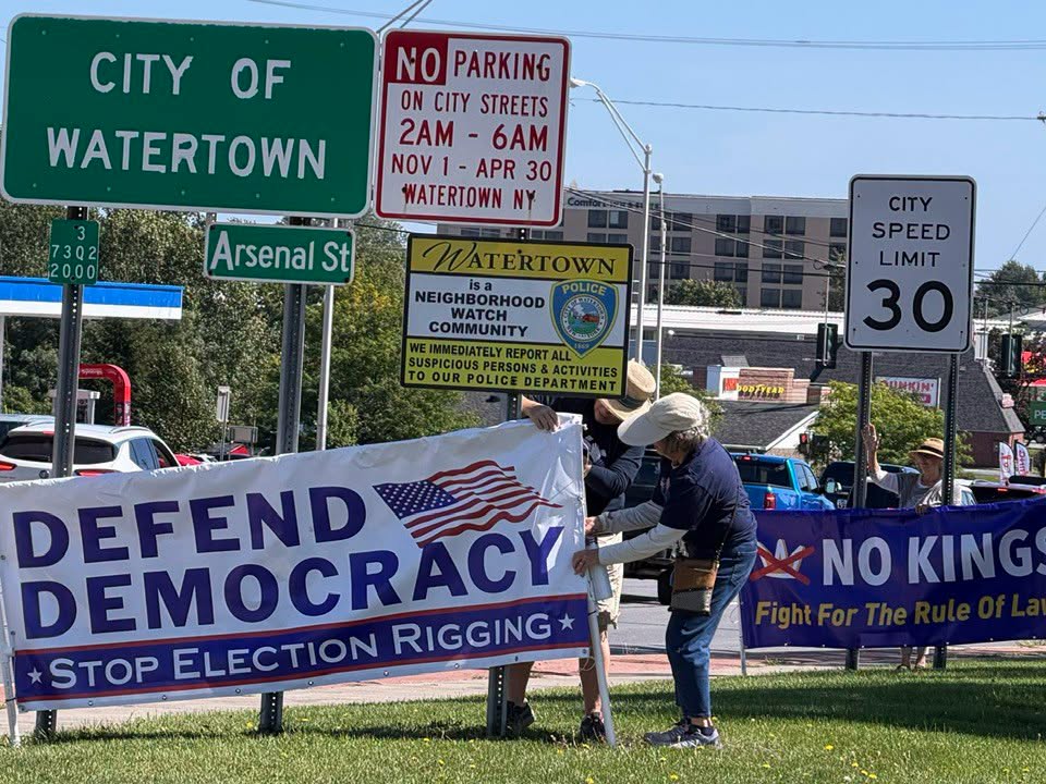 Color photo of JCDC members participating in the Stronger Together Rally and NYS Bridge Banner Project on Sept 12, 2026 in Watertown